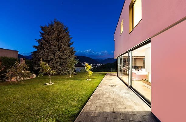 Modern villa with garden, night scene